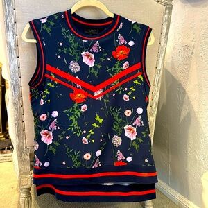 Ted Baker sleeveles navy floral top with knit trip. Matching navy pants.